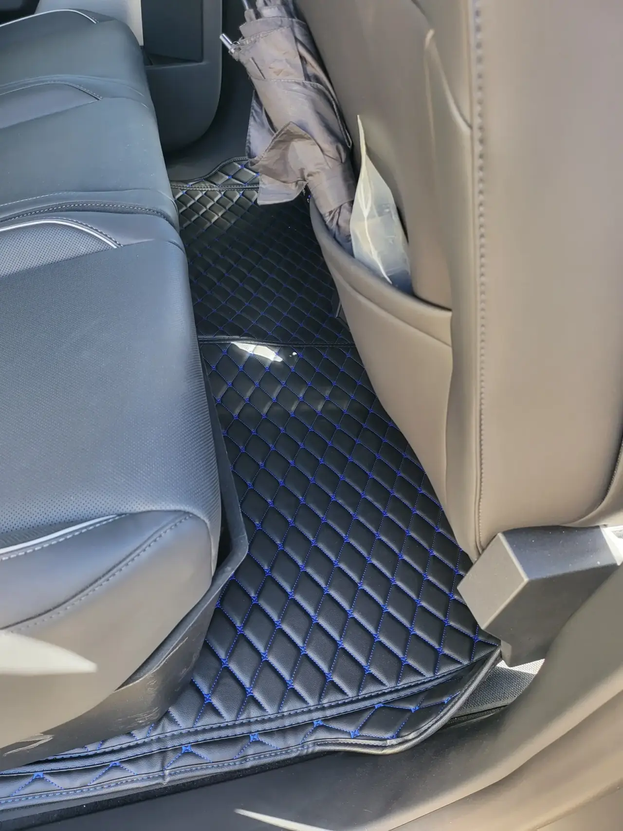 Custom leather floor mats installed in Tesla Cybertruck 2nd Row